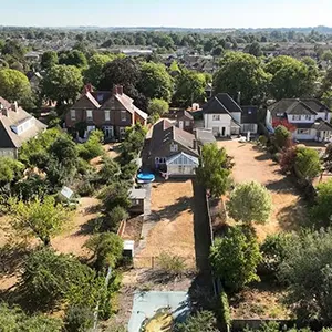 An aerial view of a neighborhood with lots of trees.