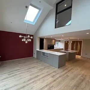 An empty room with a skylight in it.