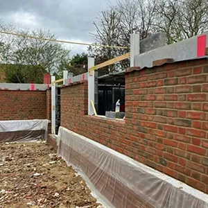 A brick wall with a sheet covering it.