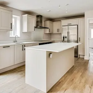 A large kitchen with a center island in the middle of the room.