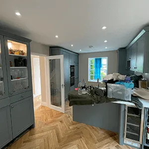 a kitchen that has a lot of cabinets in it