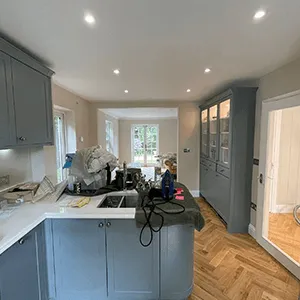 a kitchen that has a sink and a stove in it