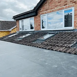 a house with a roof that has a tiled roof
