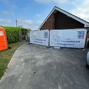 a car parked in a driveway next to a house
